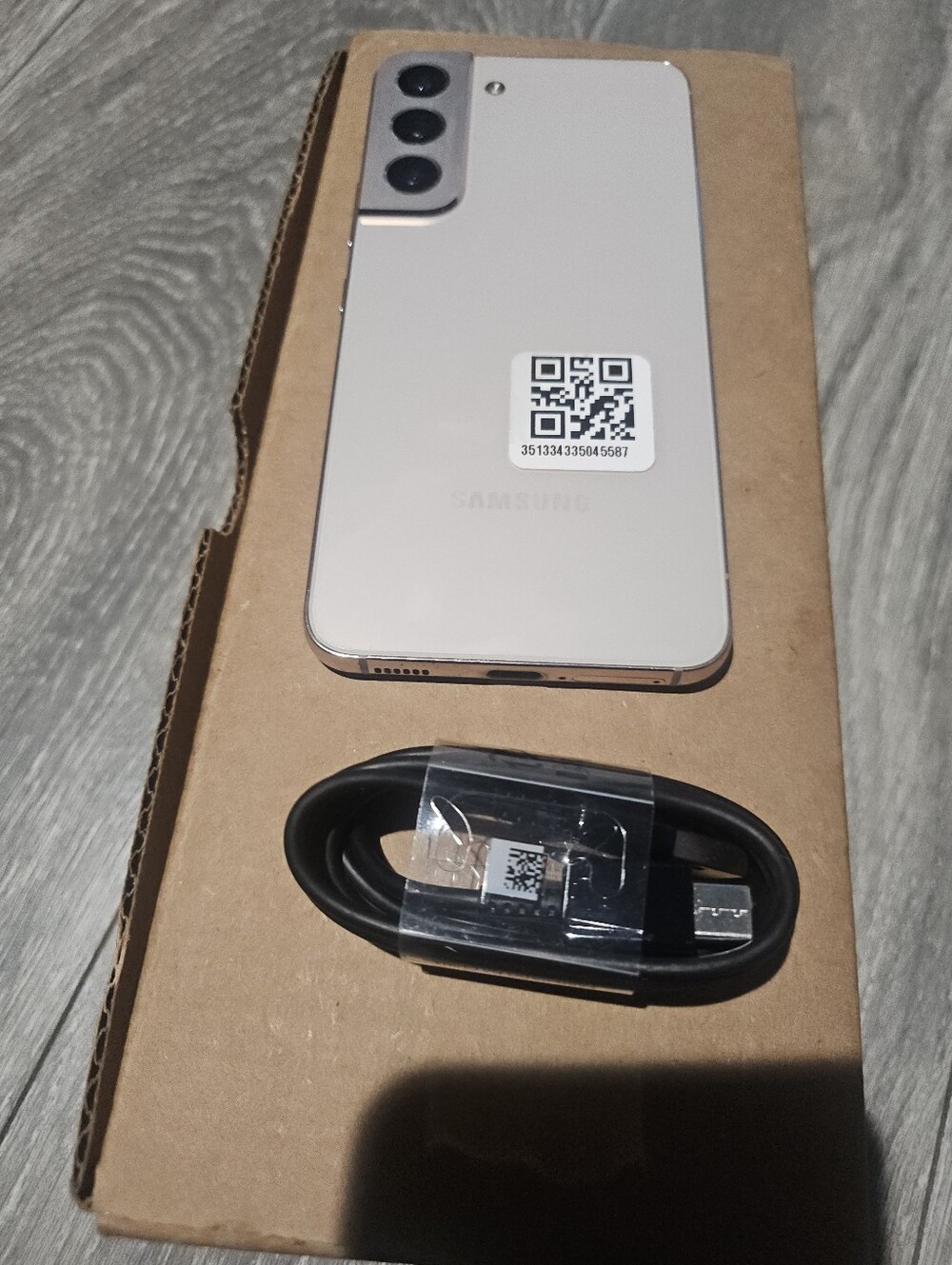 Samsung Galaxy S22 Rose Gold Smartphone with Black USB-C Cable